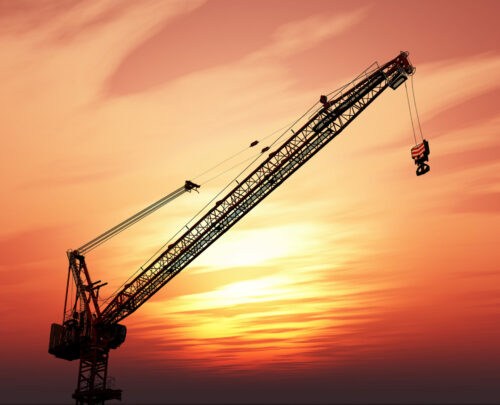 3D render of a crane against a sunset sky